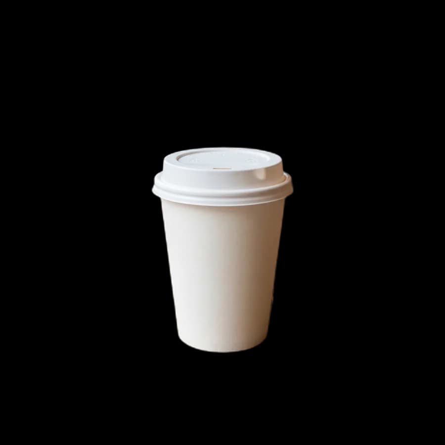 Takeaway coffee cup on a café table with the background removed